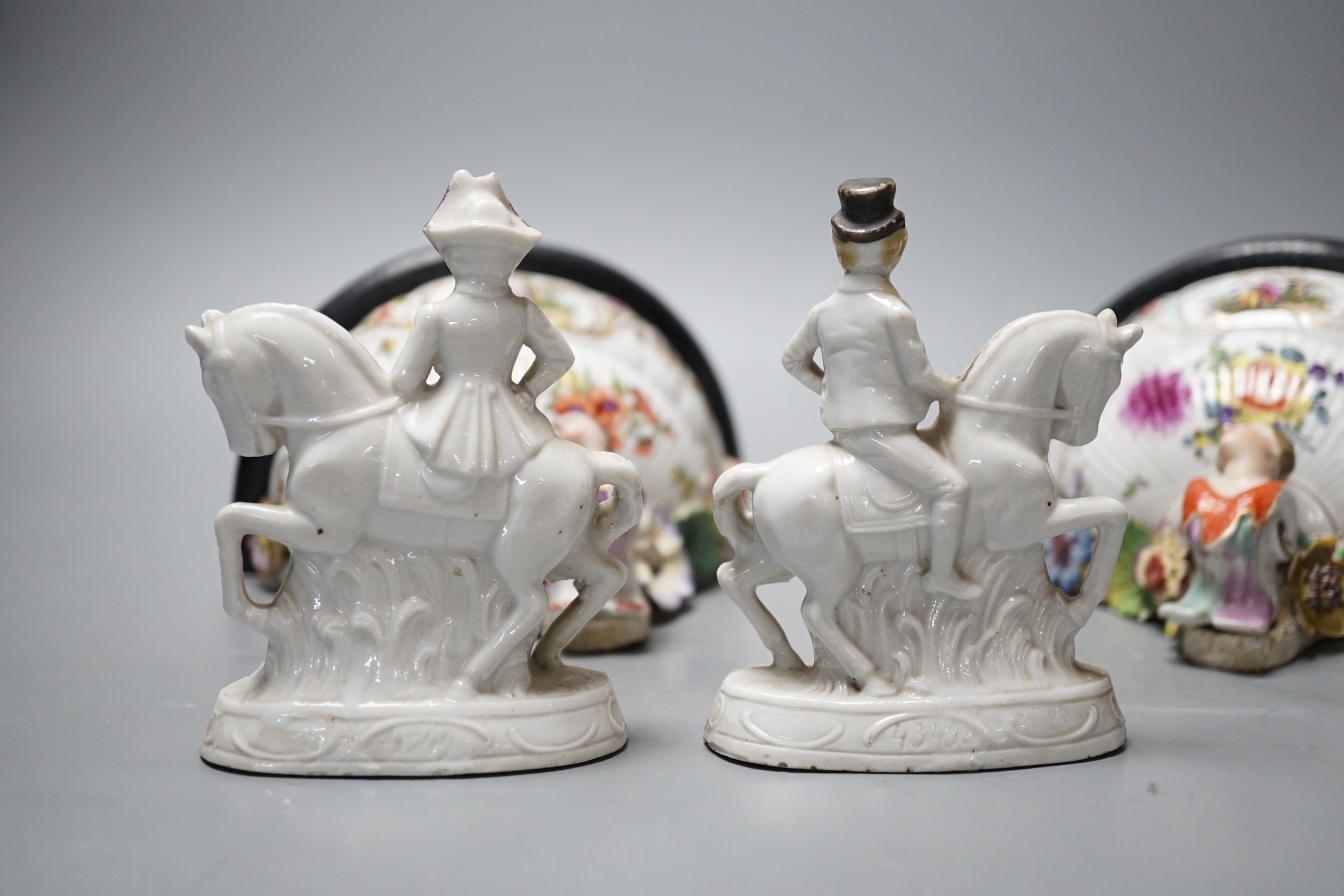 A pair of Dresden porcelain wall brackets and a pair of porcelain horses and riders, 12cm tall